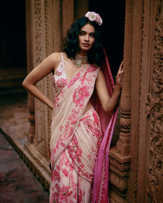 This ivory abstract pink floral pre-draped saree is a perfect look for the festive season or wedding ceremonies