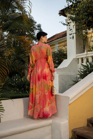 Model posing from the back, a full length Kaftan with long sleeves and a string to tie at waist.