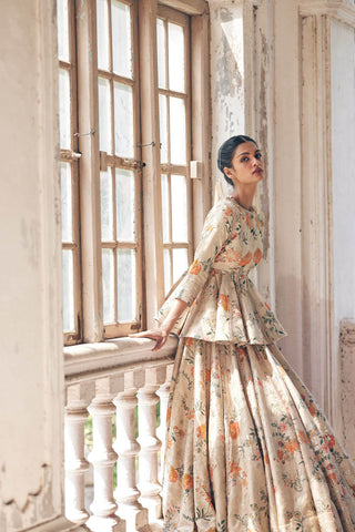 This chickoo peplum lehenga with veil is a russian selfwoven jacquard set from pret luxury collection designed by Paulmi and Harsh. A  wedding attire for south asian brides.