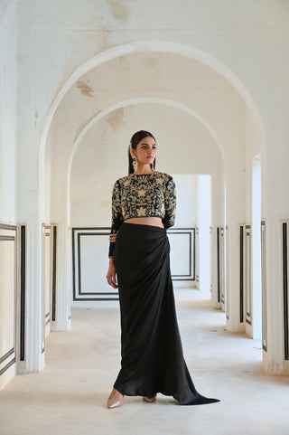 Turn heads with our Full Sleeve Jaal Embroidered Crop Top paired with a graceful Cowl Skirt. Featuring intricate big flower jaal embroidery and a contemporary silhouette, this ensemble is the perfect blend of traditional craftsmanship and modern elegance. Ideal for weddings, parties, or festive occasions. Designed by Ease.
