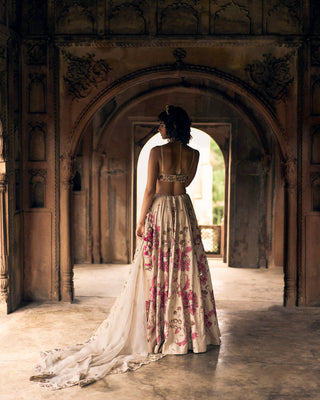 A close up look of the back blouse and lehenga with dupatta