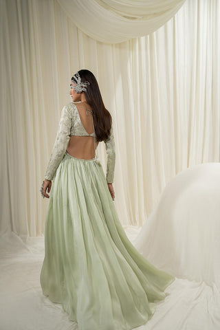 Model showcasing the back of the Anarkali dress with cut in the back for extra touch of elegance.