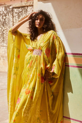 A lime yellow kaftan set is a indian designer peice for all age women.