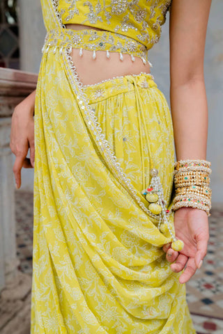 A close up look of the matching silk embroidered waist belt and moss green georgette hand block jaal printed pre-pleated draped dupatta.