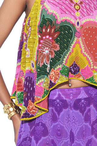 Close up look of multi color embroidered crop top with violet
print pleated palazzo.