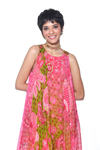 Embrace effortless elegance with this Orange High-Low Tunic, adorned with intricate hand embroidery. The flowy silhouette complements the bold charm of Gulabi Pink Chevron Printed Pants, creating a vibrant and stylish fusion look perfect for bohemian cocktail parties and Date Night, photo shoots, musical festivals.