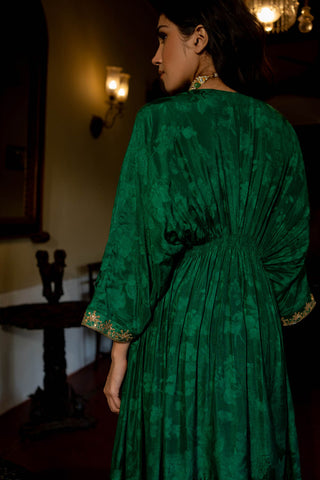 Model in Paulmi and Harsh Caftan set with pant showcasing the back of the Kaftan with elastic gathering to accentuate the waist.