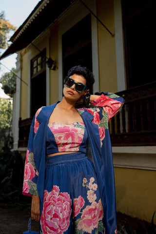 Indo Western blue shade jacket set in vibrant floral print designed by Paulmi and Harsh. A perfect women clothing for evening outwear, a beach wear, party, summer wear, dinner date, fancy brunch date, a dress to flaunt and style for any occasion.