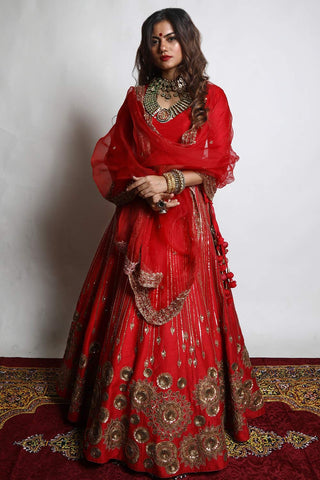 Featuring a Red Lehenga hand embroidered with intricately designed Chakra motifs, A scalloped red dupatta and blouse