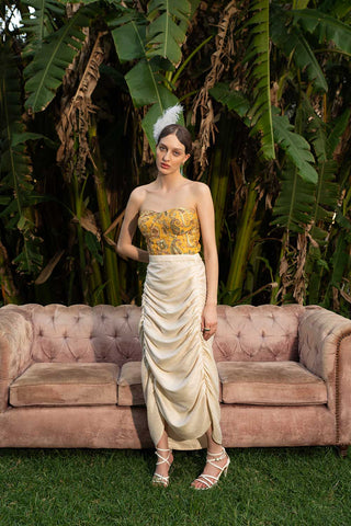 Command attention and radiate elegance in this regal Yellow Banarasi Jacquard Corset with Gold Embroidery and Ivory Ruffle Pencil Skirt Set. This statement-making ensemble is a perfect blend of rich Indian tradition and modern design, ideal for making a lasting impression at any special occasion. A perfect attire for parties, cocktail, office events or formal parties