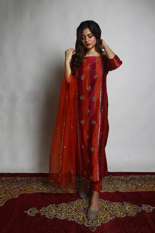 Featuring a straight Patchwork Kurta embroidered with intricately designed motifs. Paired with matching Narrow Pants and an embroidered Dupatta.