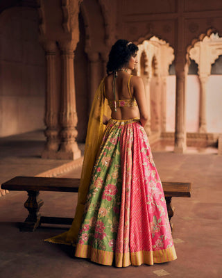 A close up look from the back of the blouse and laheriya lehenga and its work.